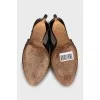 Patent leather slingbacks with golden bow