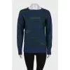 Cashmere sweater decorated with rhinestones