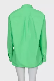 Green suit of shirt and shorts
