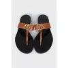 Brown flip flops with logo