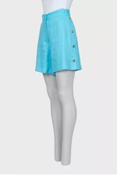 Blue shorts with gold buttons