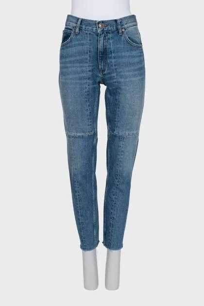 Jeans with raw edges and distressing