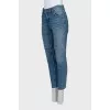 Jeans with raw edges and distressing