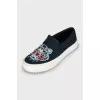 Textile slip-ons with embroidery