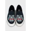 Textile slip-ons with embroidery