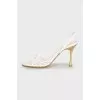 White sandals with golden heels