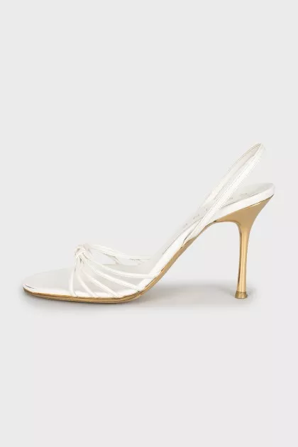White sandals with golden heels