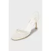 White sandals with golden heels