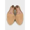 Yellow suede wedge shoes