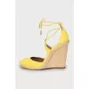 Yellow suede wedge shoes