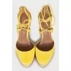 Yellow suede wedge shoes