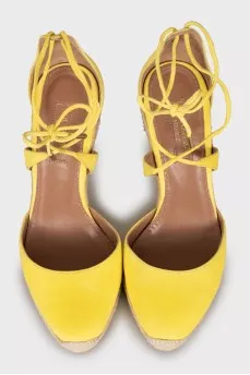 Yellow suede wedge shoes