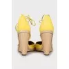 Yellow suede wedge shoes