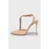 Suede slingbacks decorated with chain