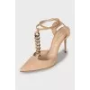 Suede slingbacks decorated with chain