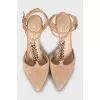 Suede slingbacks decorated with chain