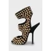 Sandals with golden spikes
