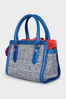 Textile bag with tassels