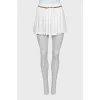 White pleated mini skirt