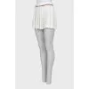 White pleated mini skirt
