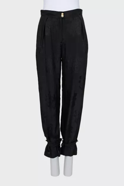 Trousers with ties at the bottom