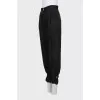 Trousers with ties at the bottom
