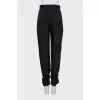 Trousers with ties at the bottom
