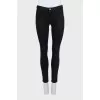 Skinny jeans with decorated pockets