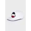 White cap decorated with a patch