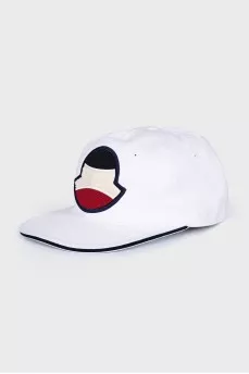 White cap decorated with a patch