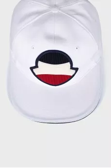 White cap decorated with a patch