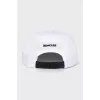 White cap decorated with a patch