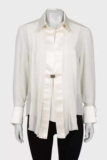 Silk blouse decorated with pleats