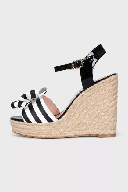 Black and white sandals with bows