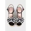 Black and white sandals with bows