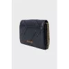 Black leather bag with gold chain