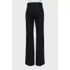 Straight trousers with decorative buttons