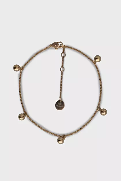 Gold bracelet with round pendants
