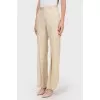 Beige trousers with flared trousers
