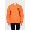Orange hoodie with print
