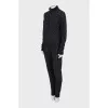 Suit of a cardigan with a zipper and trousers