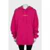 Pink hoodie with brand logo
