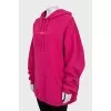 Pink hoodie with brand logo