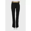 Wool trousers with golden belt