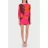 Silk bright dress with a cut on the back