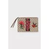 Leather and canvas clutch decorated with patches
