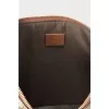 Leather and canvas clutch decorated with patches