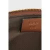 Leather and canvas clutch decorated with patches