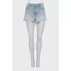 Blue distressed denim shorts