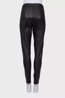 Leather trousers with zippers at the bottom